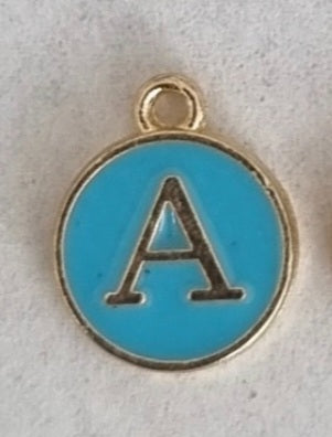Gold plated double sided blue enamel letter charm, front side