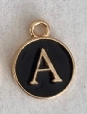 Gold plated double sided black enamel letter charm, front side
