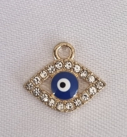 Gold plated evil eye charm, front side